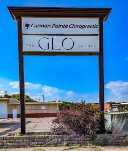Sign for Cannon Pointe Chiropractic and Glo Lounge.